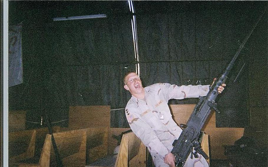 Erik Schei poses with the gun he called ''Big Baby Jesus'' while in Iraq.