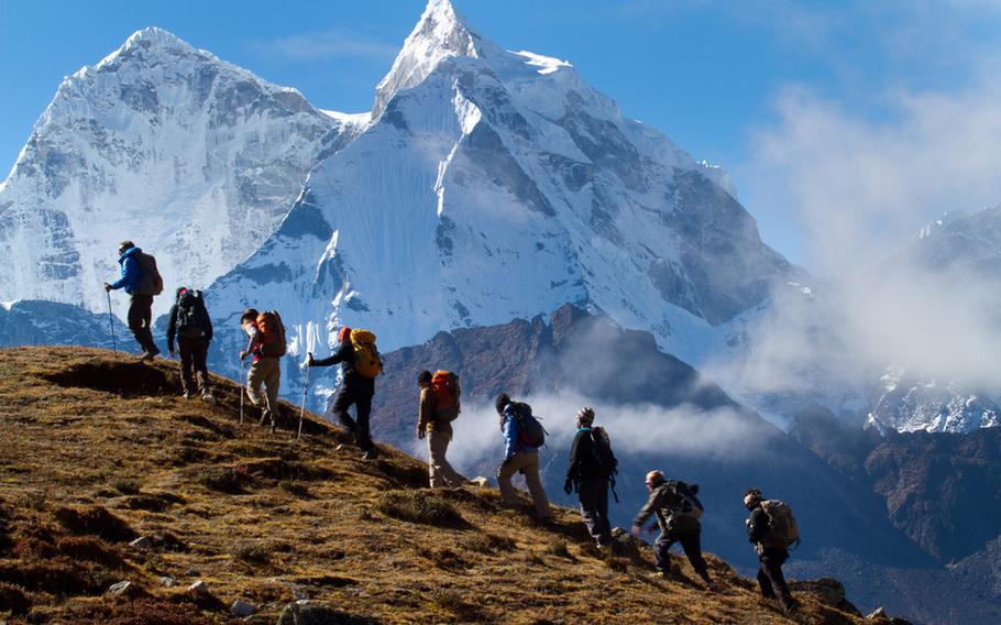 A group of wounded vets makes the climb up the 20,100-foot Lobuche Peak in Nepal. The expedition launched a new program, Soldiers to Summits, which aims to empower vets who suffered severe injuries, such as amputations.
