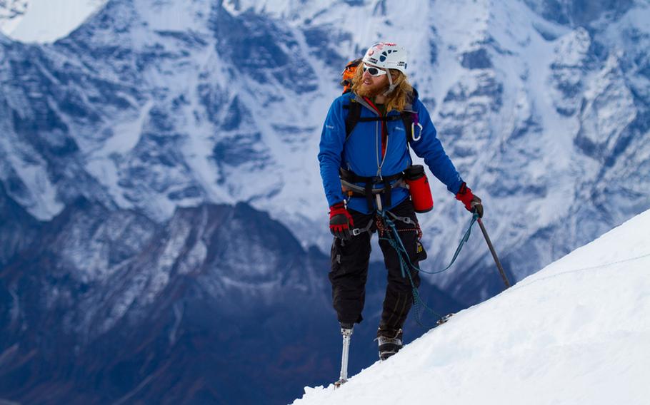 Chad Jukes, a wounded veteran, approaches the summit of a mountain peak high in the Himalayas. The 2010 ascent up the Lobuche Peak is the subject of a new documentary film and also served as the inspiration for a new program that uses mountain climbing as a way to help veterans overcome the scars of war.