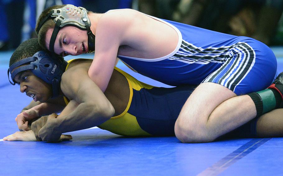 Justin Zapata of Ramstein, top, defeated Heidelberg's Aaron Gauff in a 152-pound match in Ramstein, Saturday.