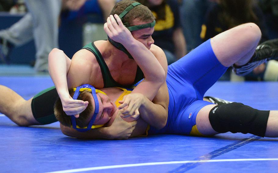 In a 160-pound match in Ramstein on Saturday, SHAPE's Roger Cloutier, top, got the best of Bamberg's Brandon Stilton.
