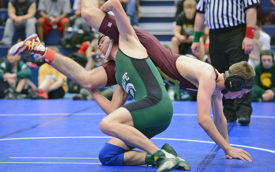 SHAPE's Karl Kristensen, left, and Baumholder's Daniel Barclay tangle in a 132-pound match at Ramstein Saturday.