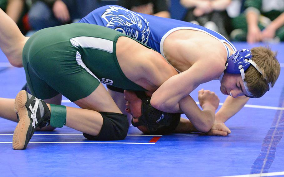 Joey Fortunato of Ramstein, top, beat SHAPE's Jared LuGrain in a 113-pound match in Ramstein on Saturday, as DODDS high school sports got under way again this weekend following the holiday break.