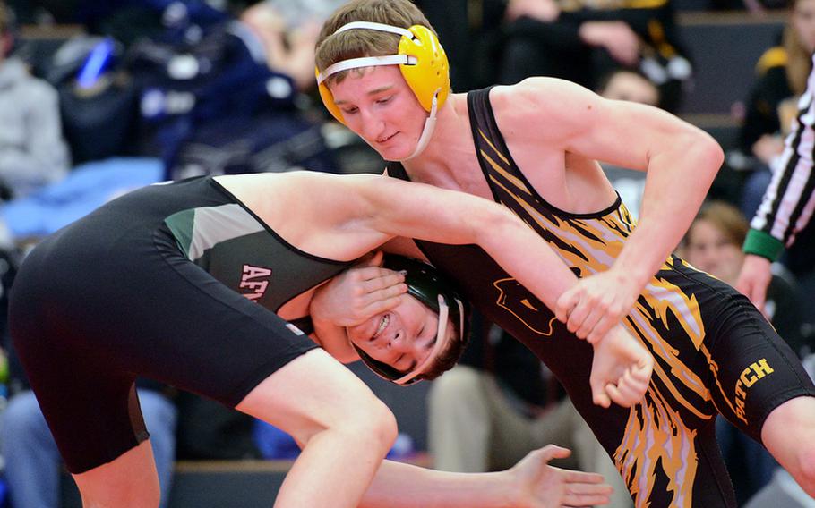 Patch's Jaden Fields, right gets a grip on AFNORTH's Saverio Young in a 138-pound match in Kaiserslautern on Saturday. Fields won the match as DODDS high school sports got under way again this weekend following the holiday break.