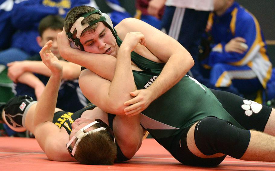 AFNORTH's Luke Narug, right, puts the pressure on Patch's Michael Mineni, on his way to winning the 220-pound match in Kaiserslautern on Saturday.