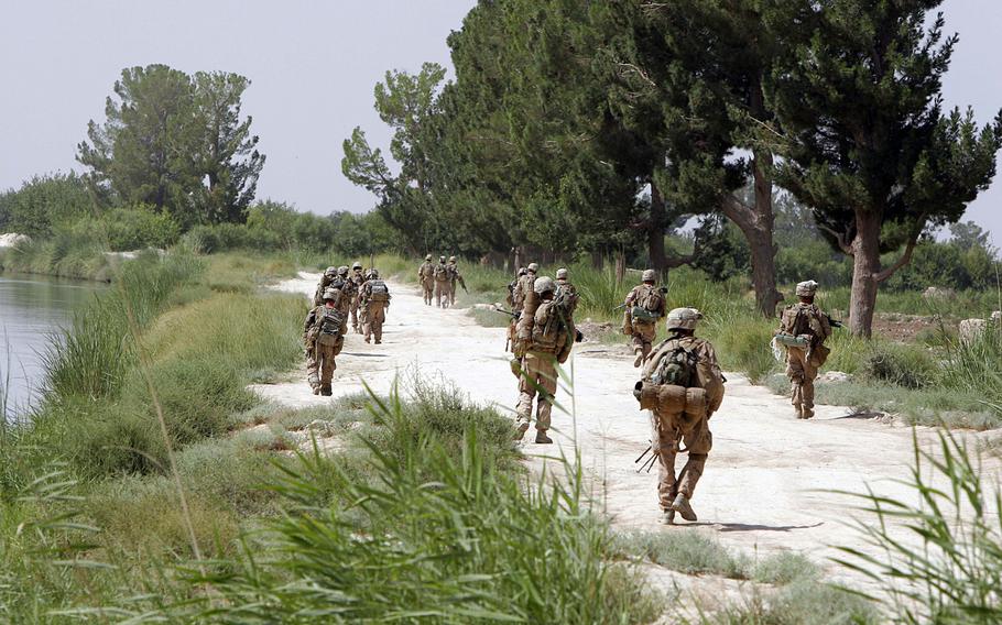 U.S. Marines with 2nd Battalion, 8th Marine Regiment, Regimental Combat Team 3, patrol through Afghanistan's southern Helmand province during Operation Khanjar.