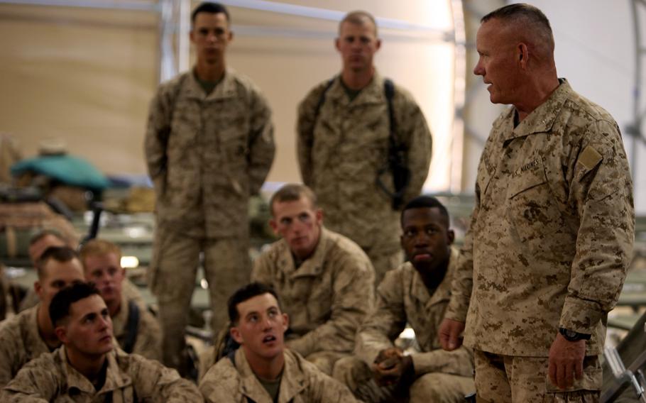 Brig. Gen. Larry D. Nicholson, commanding general of Marine Expeditionary Brigade-Afghanistan, speaks to the Marines of Company R, 5th Battalion, 10th Marine Regiment, MEB-Afghanistan, as they finish their deployment in Helmand, Nov. 11, 2009. The Marines provided security for Camp Dwyer during their tour.