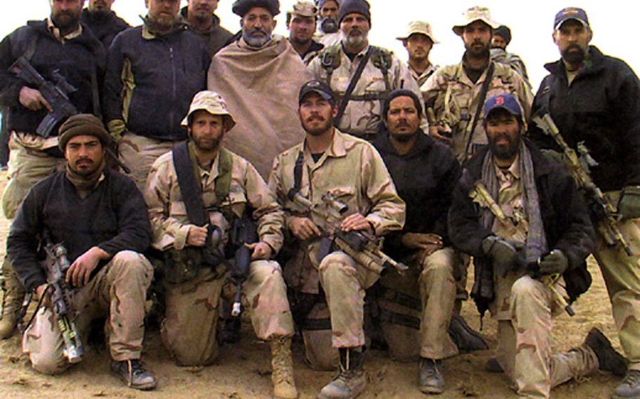 The A-Team with Karzai in November, 2001.
Magallanes is in the front row, fourth man from the left.