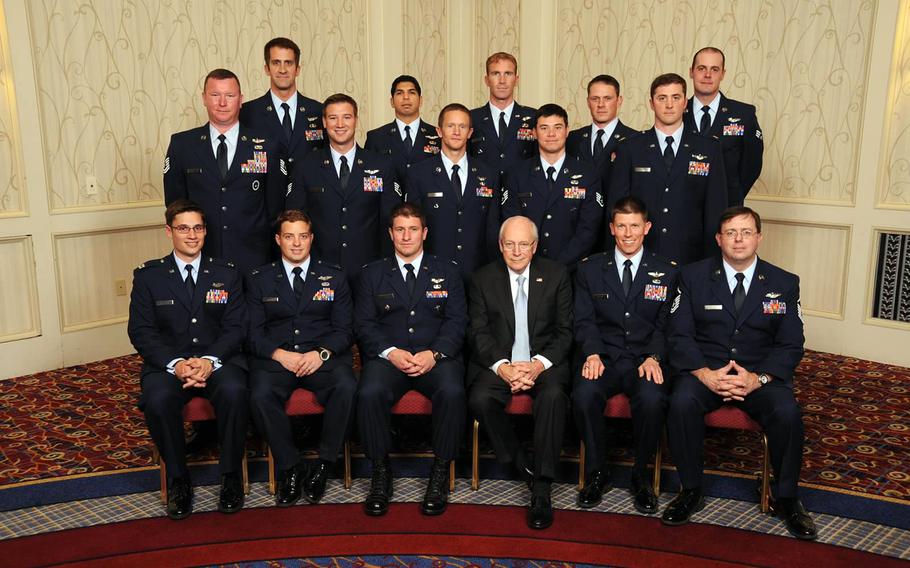 Pilots, crew and pararescue jumpers involved in the April 23, 2011, rescue of a downed helicopter pilot in Afghanistan pose for a photo with former Vice President Dick Cheney after receiving the Air Force's Mackay Trophy for most meritorious flight of 2011. Pictured are, Back row (left to right): Staff Sgt. Zachary Kline; Staff Sgt. Jason Ruiz; Major Jesse Peterson; Technical Sgt. Christopher Uriarte; Senior Airman Michael Price; Middle row (left to right): Technical Sgt. Heath Culbertson; Staff Sgt. Justin Tite; Technical Sgt. Shane Hargis; Staff Sgt. Nathan Green; Major Joshua Hallada; Front row (left to right): Capt. Elliott Milliken; Capt. Louis Nolting; Capt. Aaron Hunter; Major Philip Bryant; Master Sgt. James Davis
