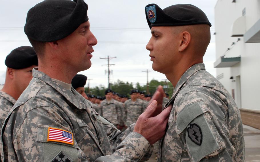 In a ceremony July 23, 2012, at Fort Wainright, Alaska, Col. Brian Reed, commander of the 1st Stryker Brigade Combat Team, 25th Infantry Division, pins the Bronze Star with Valor on Sgt. Stephen Stoops, a soldier in the brigade's 1st Battalion, 24th Infantry Regiment, for his response to an "insider attack" on a base in Afghanistan's Zabul Province in January 2012.