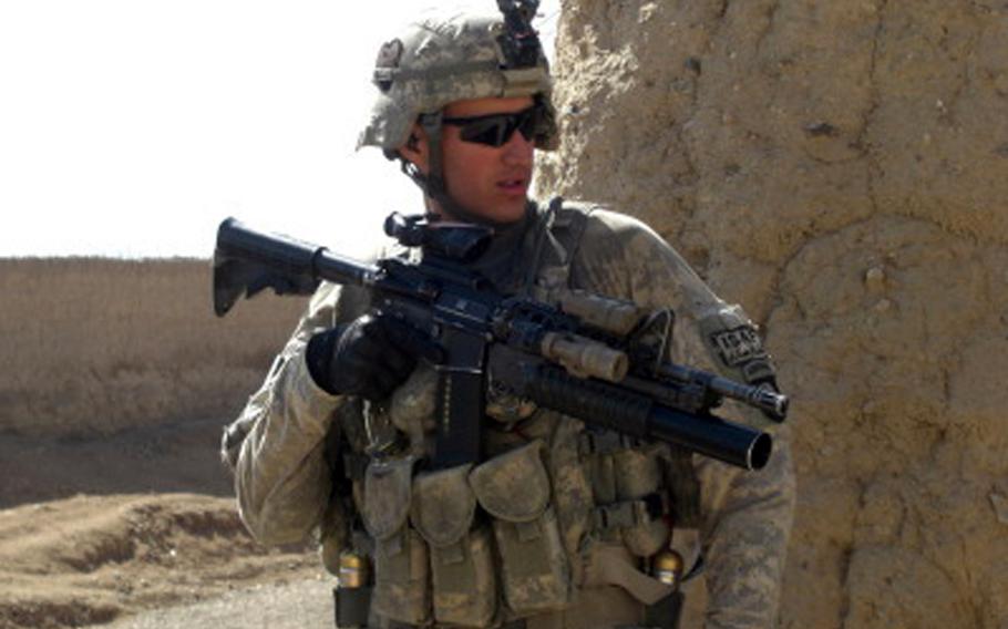 Then-Spc. Felipe Pereira on patrol in Senjaray, Afghanistan, in early 2011, several months after being seriously wounded in a Nov. 2010 attack outside his base. Pereira, now a sergeant, was awarded the Distinguished Service Cross for helping to evacuate other injured soldiers from the attack site while under fire.
