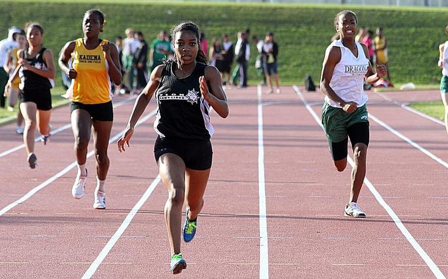 Zion Christian Academy's Jade Cummings leads the pack toward the finish of the girls 400-meter run during Friday's Okinawa Activities Council track and field quadrangular meet at Kadena Air Base, Okinawa. Cummings won in 1 minute, 2.44 seconds.
