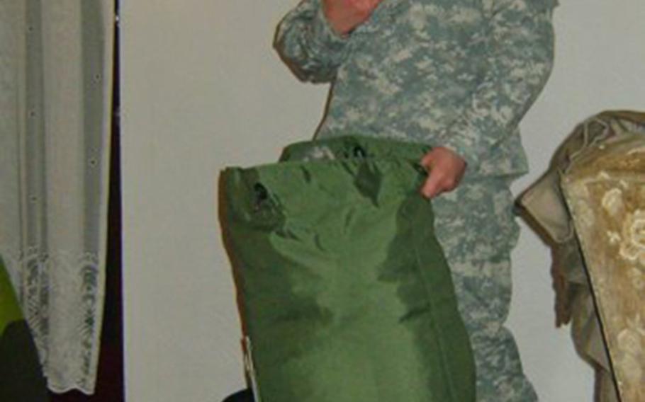 Julia Bringloe packs her bag before she deploys to Afghanistan.
