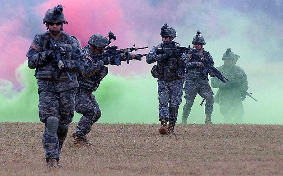 Soldiers of 1st Battalion, 296th Infantry Regiment, Puerto Rico National Guard, conduct a skills presentation at Camp Santiago Joint Maneuver Training Center, Salinas, Puerto Rico, during the change of responsibility and retirement ceremony.