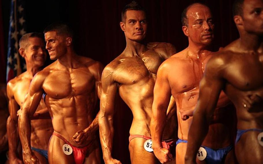 Male competitors show the judges a side view in the 2013 Bodybuilding and Figure Invitational in Kaiserslautern on Saturday.