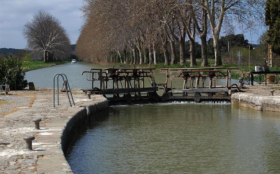 It can take about 15 minutes for the water level to rise or fall to meet the adjacent waterway on the Canal du Midi in France. The terrain along the canal varies in elevation from zero to 620 feet above sea level. To compensate for the changes in elevation, a series of 91 locks raises or lowers boats from one section of the canal to the next.