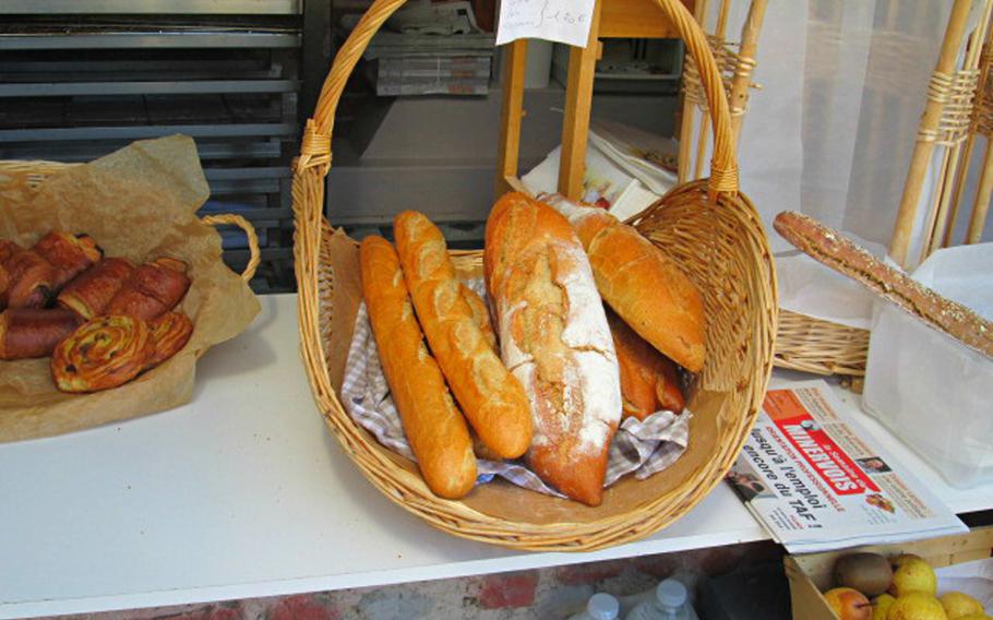 Freshly baked baguettes and pastries are sold in tiny shops of all kinds along the canal.