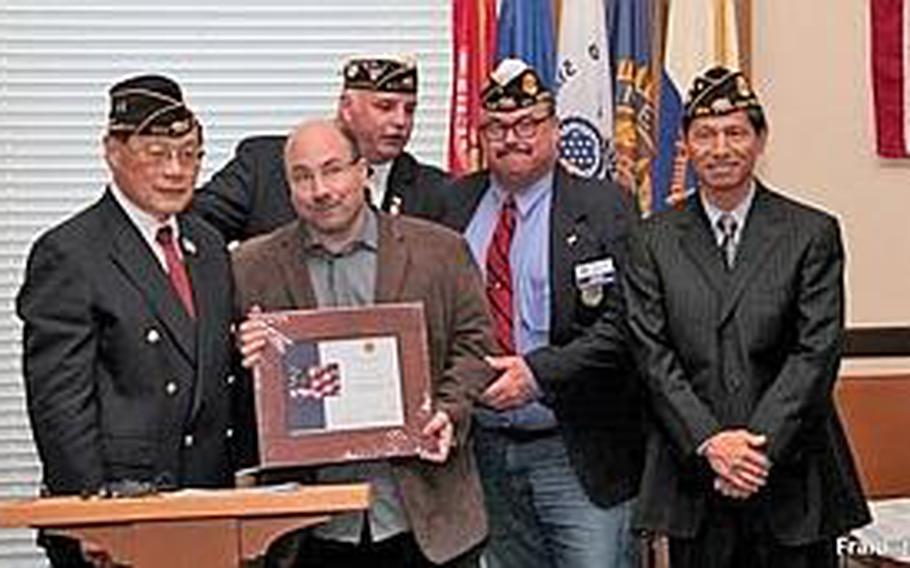 Craig Newmark (second from left), founder of Craigslist and the foundation craigconnects, receives a certificate of thanks for his financial support of the American Legion’s Veterans Success Center. Newmark is part of a fundraising challenge at CrowdRise attempting to benefit charities for veterans. The challenge ends July 3.