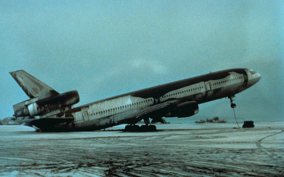 Mount Pinatubo, Philippines. View of World Airways DC-10 airplane setting on its tail because of weight of June 15, 1991 ash. Cubi Point Naval Air Station.