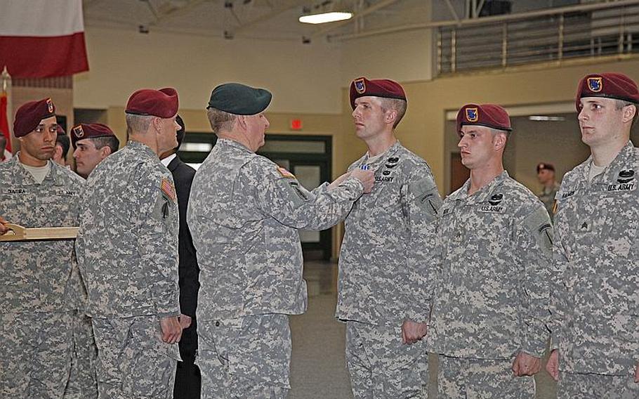 Lt. Gen. Charles Cleveland, Commander, US Army Special Operations Command, presents awards to members of the 160th Special Operations Aviation Regiment (Airborne), including Sgt. Aaron Green, second from right.