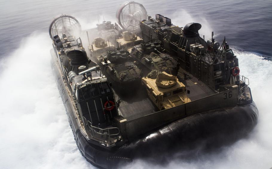 A Landing Craft, Air Cushioned vessel assigned to the USS Kearsarge, transports light-armored vehicles and Humvees assigned to the 26th Marine Expeditionary Unit, off the coast of Djibouti, on May 27, 2013.