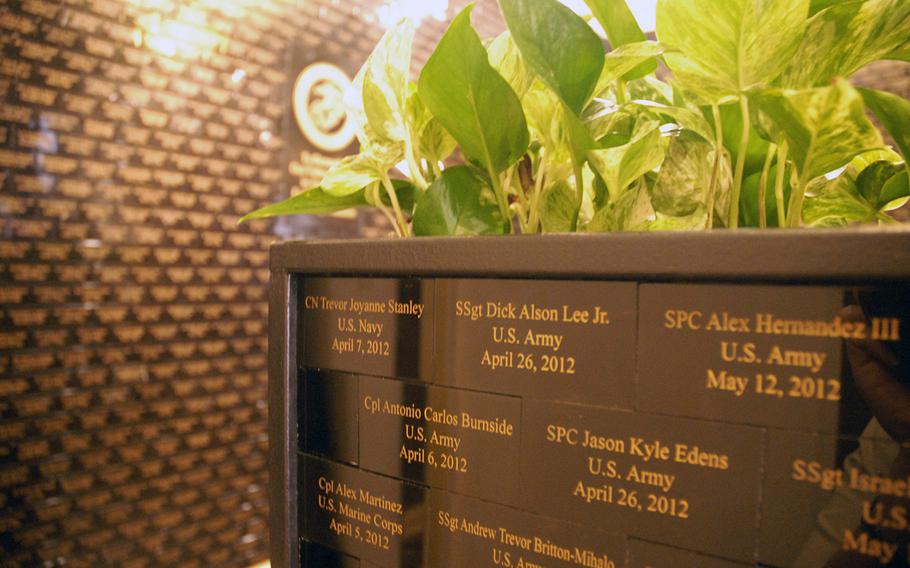 The first wall of the memorial to servicemembers killed after 9/11 at the Marines' Memorial Club and Hotel in San Francisco. The club started the tribute in 2004 and had to move to three additional walls and then a planter in the middle of the room to accommodate all the names of the fallen troops from the Iraq and Afghanistan wars.