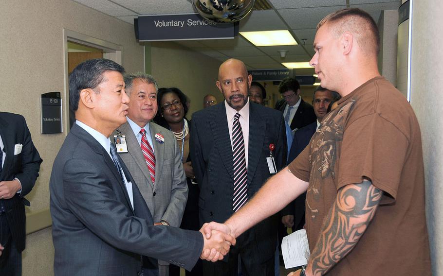 Marine Corp Veteran Steven Buckley speaks with the Secretary of Veterans Affairs, The Honorable Eric K. Shinseki during a visit to VA Tennessee Valley Healthcare System in Nashville, Tenn. Secretary Shinseki is in Nashville meeting with local VA leadership and touring various VA facilities in the area on June 23, 2010.