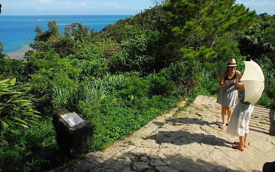 Visitors take in the ocean view at Sefa Utaki, a United Nations heritage site and the holiest location on Okinawa.