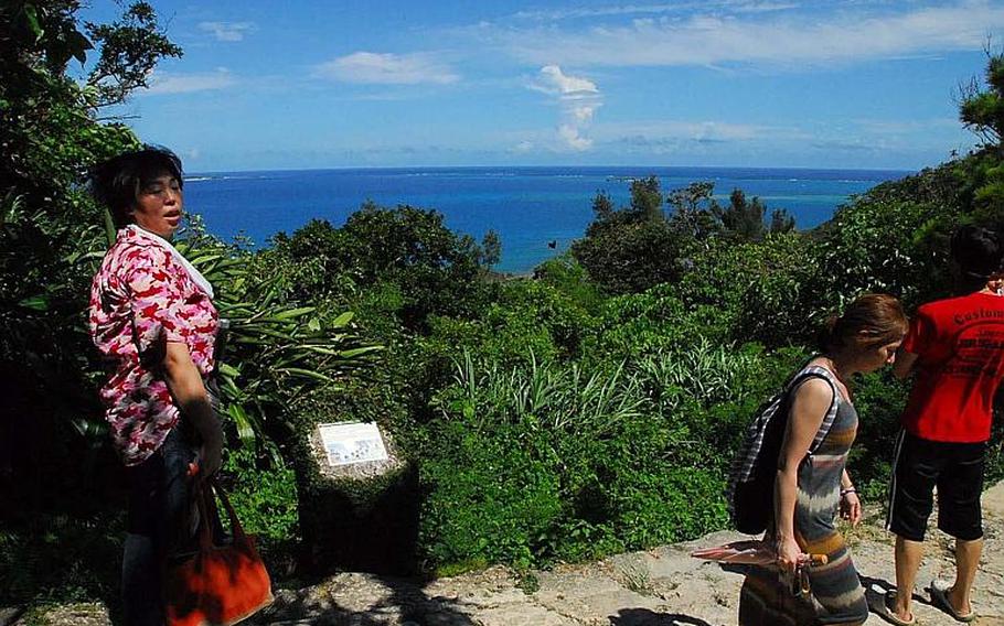 Visitors take in the ocean view at Sefa Utaki, a United Nations heritage site and the holiest location on Okinawa.