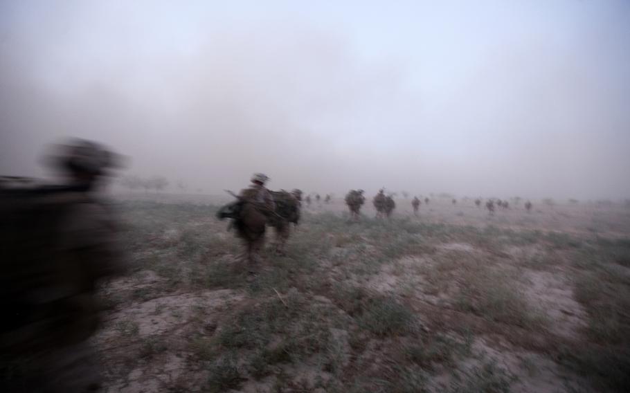British soldiers and U.S. Marines with Company G, 2nd Battalion, 8th Marines, Afghan Territorial Force 444 head out for a mission in Helmand province, Afghanistan, Aug. 31, 2013.