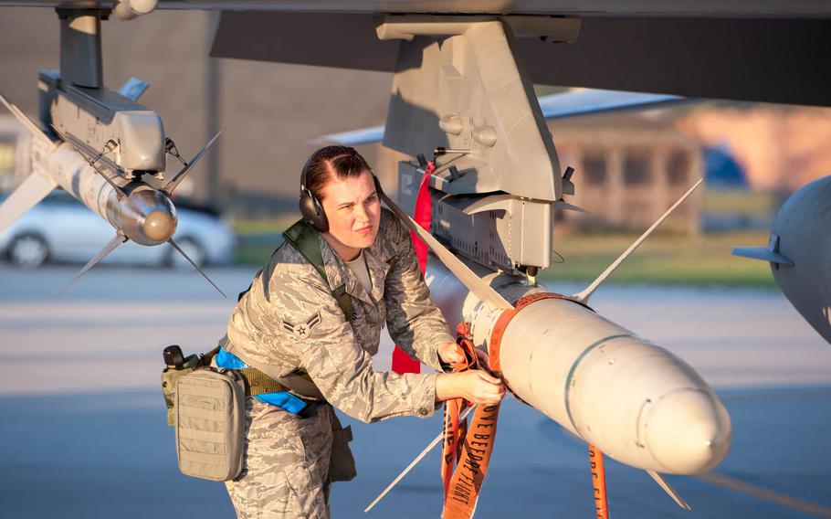 Airman 1st Class Karen Griggs, with the 169th Aircraft Maintenance Squadron at McEntire Joint National Guard Base, South Carolina Air National Guard, removes safety warning ribbons before an aircraft takes off, Sept. 9, 2013.