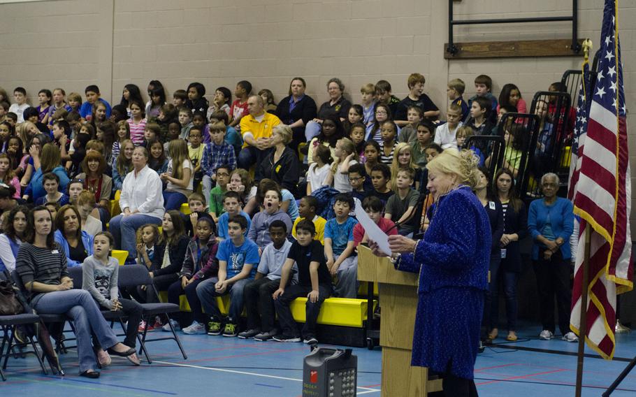 Mary Zimmerman-Bayer, principal, leads an assembly at Lakenheath Middle School on RAF Feltwell, England, celebrating the school being named a National Blue Ribbon School for 2013 by the U.S. Department of Education, Friday, Oct. 4, 2013. The annual award is given to schools where "students perform at very high levels or where students are making significant gains in academic achievement," according the award program's website. The school will receive a plaque and flag in November.