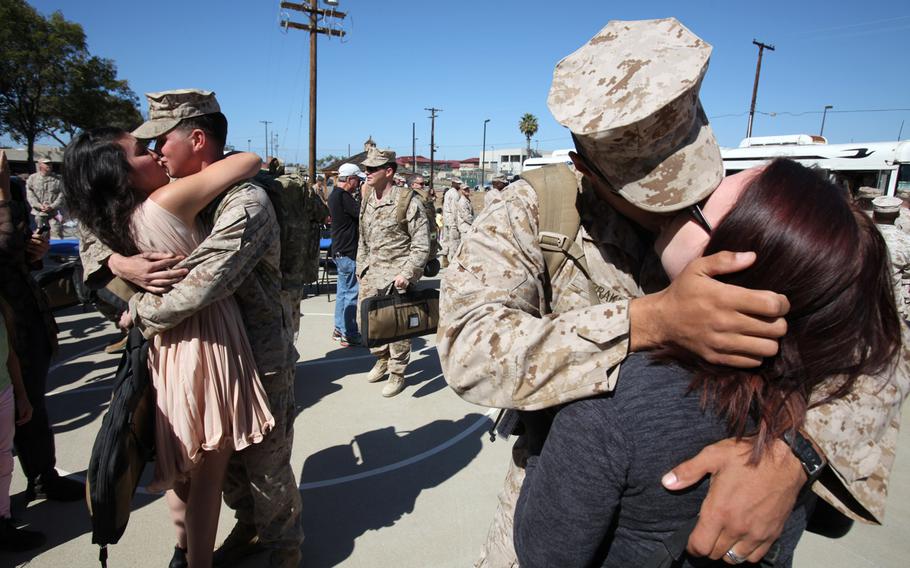 Family members greet Marines with Supporting Arms Liaison Team 8, 1st Air Naval Gunfire Liaison Company who were returning to Camp Pendleton, Calif., on Oct. 18, 2013, after a seven-month deployment to Afghanistan.