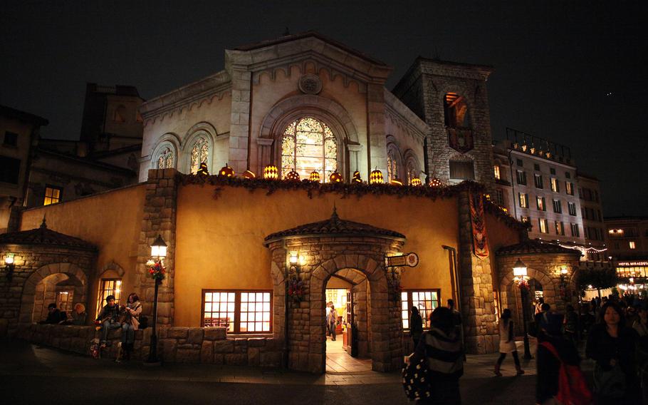 Carved jack-o'-lanterns decorate buildings and light fixtures all over Disney Sea in Tokyo.