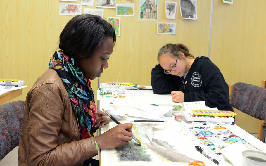 In the watercolor workshop at this year's Creative Connections, Ashley Herndon of Hohenfels, left, and Emma Rook of Ankara work on their pieces. More than 160 students from DODDS-Europe high schools participated in this year's event that features 11 workshops in the visual and performing arts.