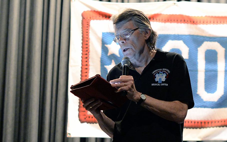 Stephen King, American author of contemporary horror, suspense, science fiction and fantasy, reads from his new book," Doctor Sleep," during a USO event Monday, Nov. 18, 2013, at Ramstein Air Base, Germany.