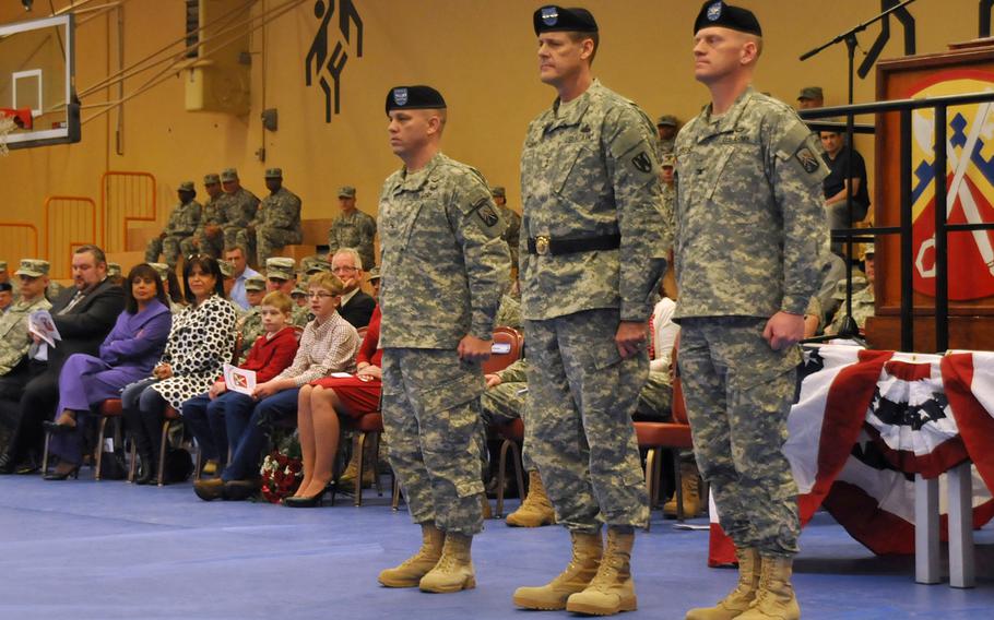 Col. J. Scott Murray, incoming commander of the 16th Sustainment Brigade; Maj. Gen. John R. O'Connor,  commanding general of the 21st Theater Sustainment Command; and Col. Darren Werner, outgoing commander of the 16th, stand in formation during a change of command ceremony at Smith Barracks, Dec. 11, 2013.  

