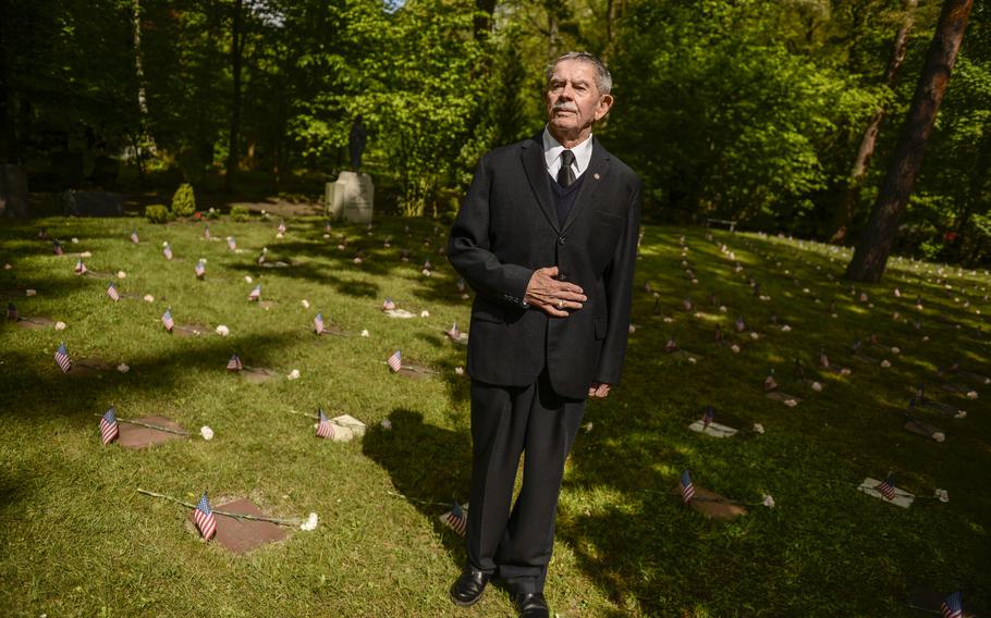 Maximilian K. Pfauntsch stands among the graves of American children in Kaiserslautern, Germany's main cemetery following a ceremony for the children, May 18, 2013. Pfauntsch, a retired U.S. Air Force chief master sergeant, was a key player in preserving the American children's graves. The ceremony is held annually.