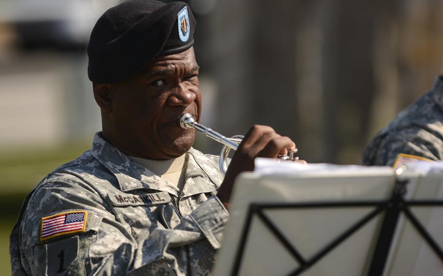 Sgt. 1st Class Frank McCaskill and the USAREUR Band and Chorus' brass quintet provide music for the 5th Signal Command change-of-command ceremony Friday, June 7, 2013, in Wiesbaden, Germany.