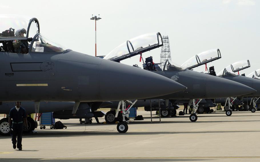 F-15Es stand on the tarmac at RAF Lakenheath, England, July 16, 2013.