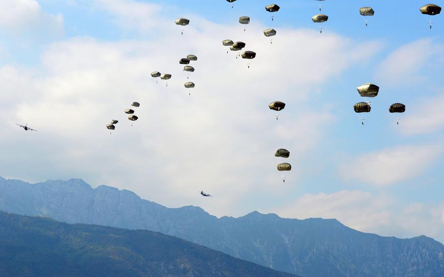 Paratroopers from the 173rd Infantry Brigade Combat Team (Airborne) dot the sky Thursday, Aug. 22, 2013, near Aviano Air Base, Italy, as they conduct a mass jump. Some of the paratroopers were jumping in Italy for the first time and with the new T-11 parachutes.