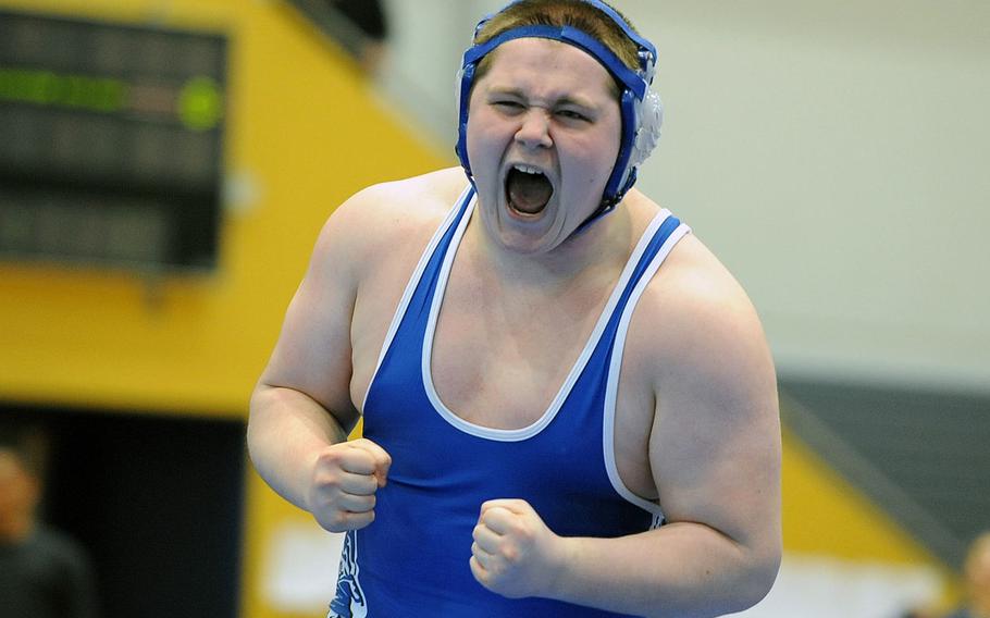 Ramstein's Christian Elliot celebrates after beating Kaiserslautern's Lotoni Afulhamago in a 285-pound match at the western sectionals in Ramstein, Germany, Feb. 9, 2013.