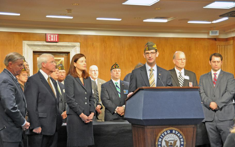 Ray Kelley, director of the Veterans of Foreign Wars legislative division, argues against plans to trim military retirement increases as part of a comprehensive budget deal, during a Capitol Hill press conference on Tuesday.