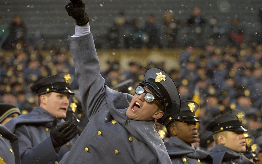 An Army cadet cheers for his team during the 114th Army-Navy football game at the Lincoln Financial Field in Philadelphia, Dec. 14, 2013. Navy won 34-7.