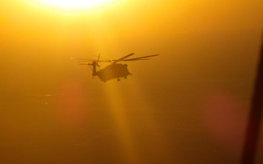 A CH-53 Super Stallion with Marine Heavy Helicopter Squadron 462 flies over southern Afghanistan Dec. 25, 2013.