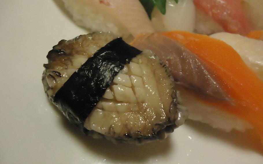 Yutaka Zushi's top-shelf sushi set features the rare delicacy abalone, which is basically a large sea snail. The salmon, second from left, is also a tasty treat.