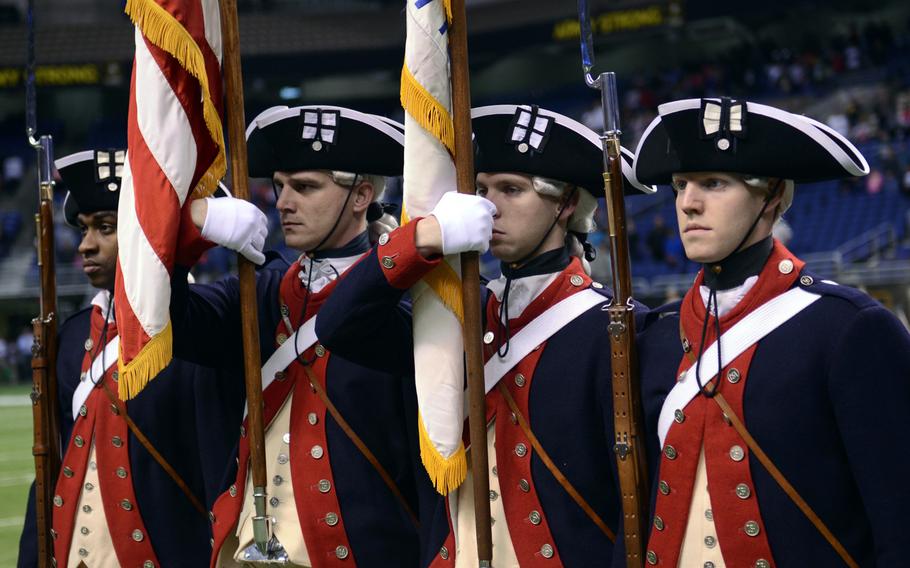 The U.S. Army Continental Color Guard presents the colors at the 2014 U.S. Army All-American Bowl at the Alamodome in San Antonio on Jan. 4, 2014. The Continental Color Guard, also known as the Old Guard, wears Revolutionary War-style uniforms to recognize the long and honorable history of the 3rd Infantry Regiment.