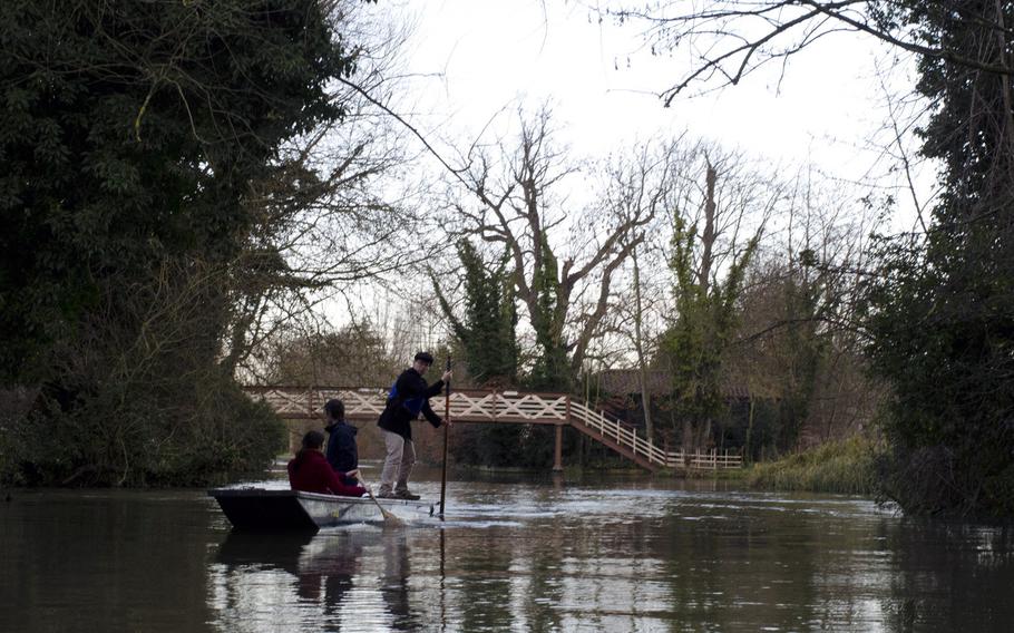 A punter takes his boat down a river in Cambridge, England, in early January. This portion of the river is used by Scudamore's Punting Co. while some of the city's famous colleges undergo maintenance.