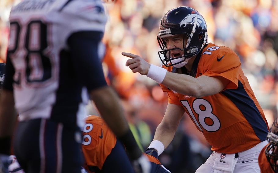 Denver Broncos quarterback Peyton Manning (18) calls out a play during the second half of the AFC Championship NFL playoff football game against the New England Patriots in Denver, Sunday, Jan. 19, 2014. (AP Photo/Charlie Riedel)