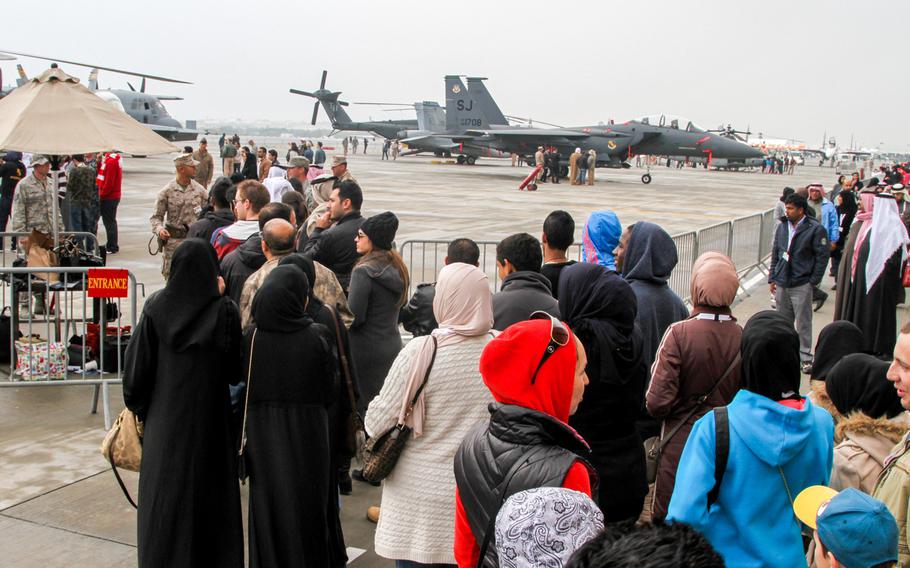 People line up for a rare escorted tour of various U.S military aircraft on display at the Bahrain International Airshow  Jan. 18, 2014.